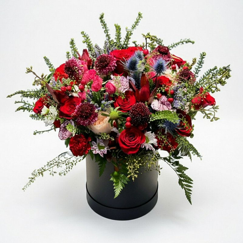 Gift box with roses and other flowers